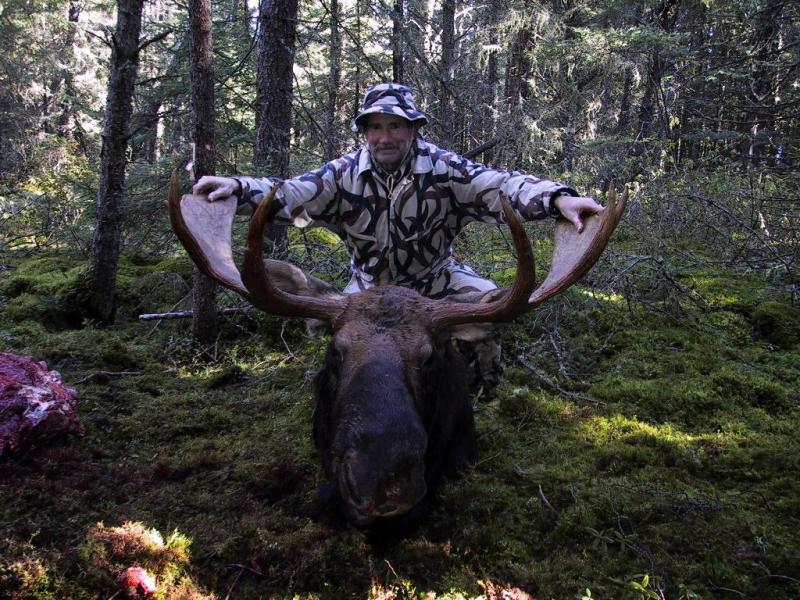 Hunter with Taken 48 Incher Bull